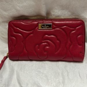 Kate spade red zippy wallet.